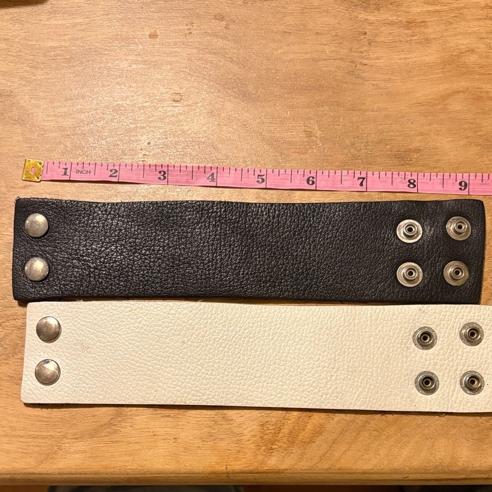 Le Chateau Black and White Leather Snap Bracelets